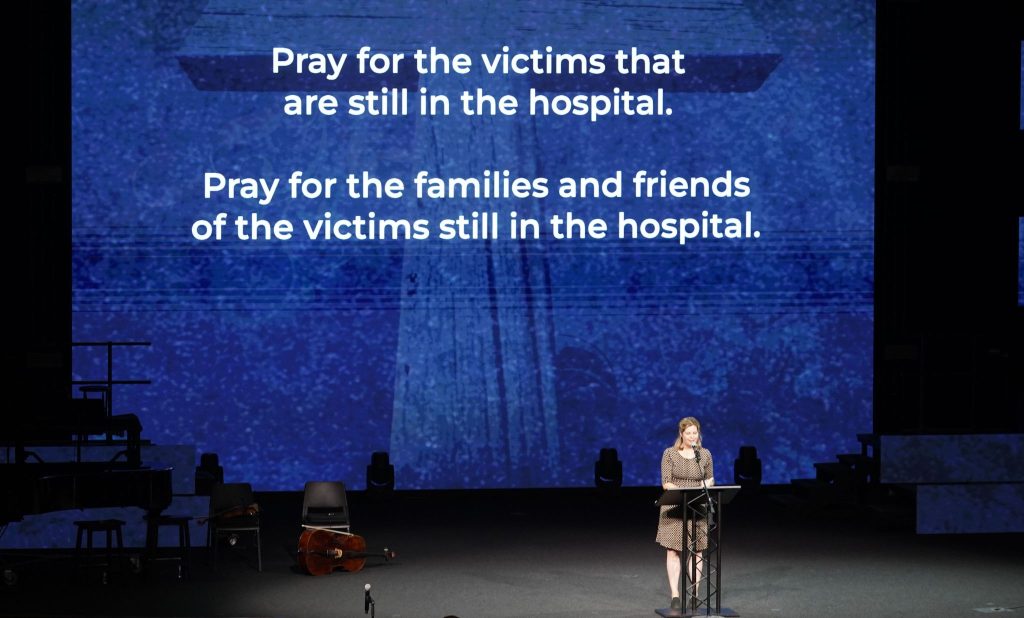 Children’s minister Kelly Kitch speaks at a community prayer service at Cottonwood Creek Church in Allen, Texas, where eight people were killed Saturday at an outlet mall.