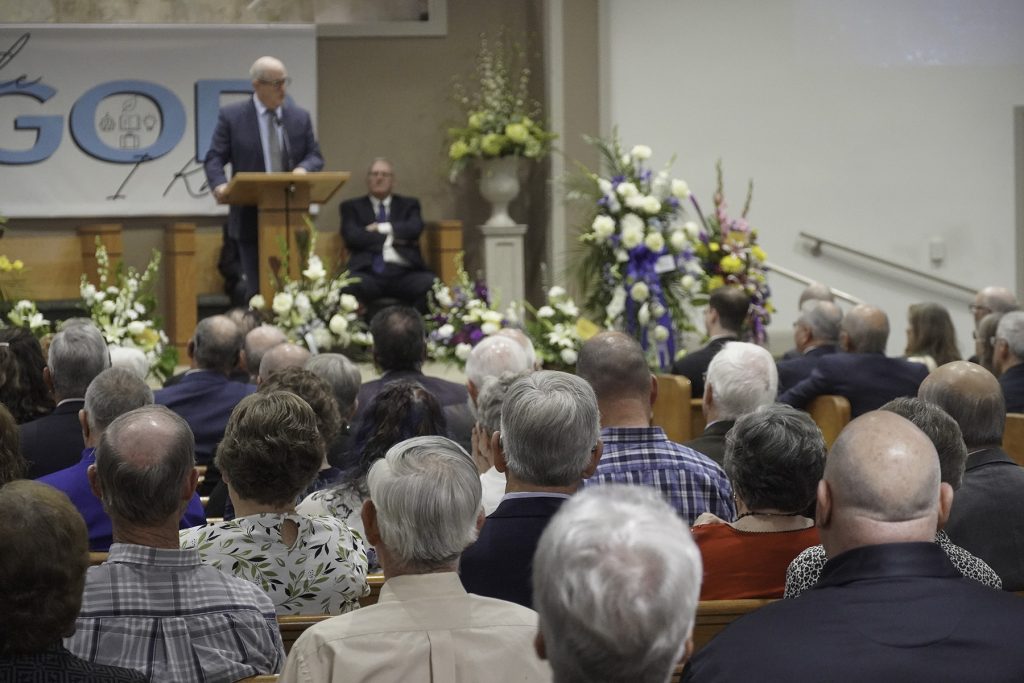 Thomas N. Norton, one of Howard and Jane Norton's three children, greets guests at a memorial service for his parents.