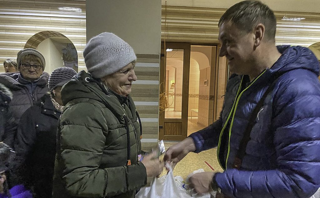 Andrii Bilokonnyi delivers humanitarian aid packages to workers and refugees staying at a former boarding school in eastern Ukraine.