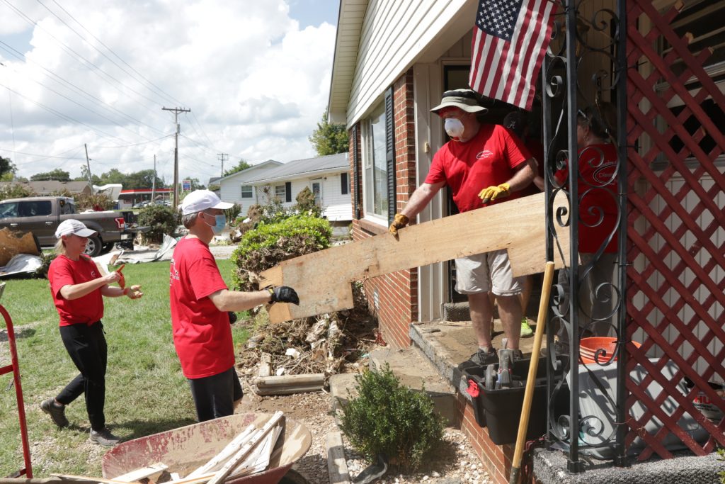 Volunteers with the Churches of Christ Disaster Response Team help with flood relief in Waverly, Tenn.