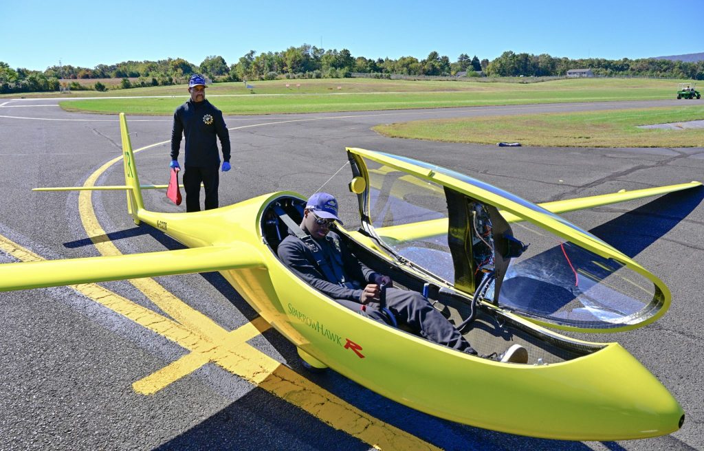 Caleb Smith climbs into a glider.