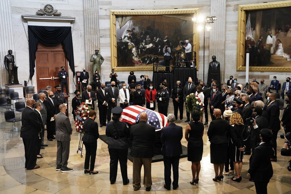 Members of the Congressional Black Caucus, say farewell at the conclusion of a service for the late Rep. John Lewis, D-Ga., a key figure in the civil rights movement and a 17-term congressman from Georgia, as he lies in state at the Capitol in Washington, Monday, July 27, 2020.