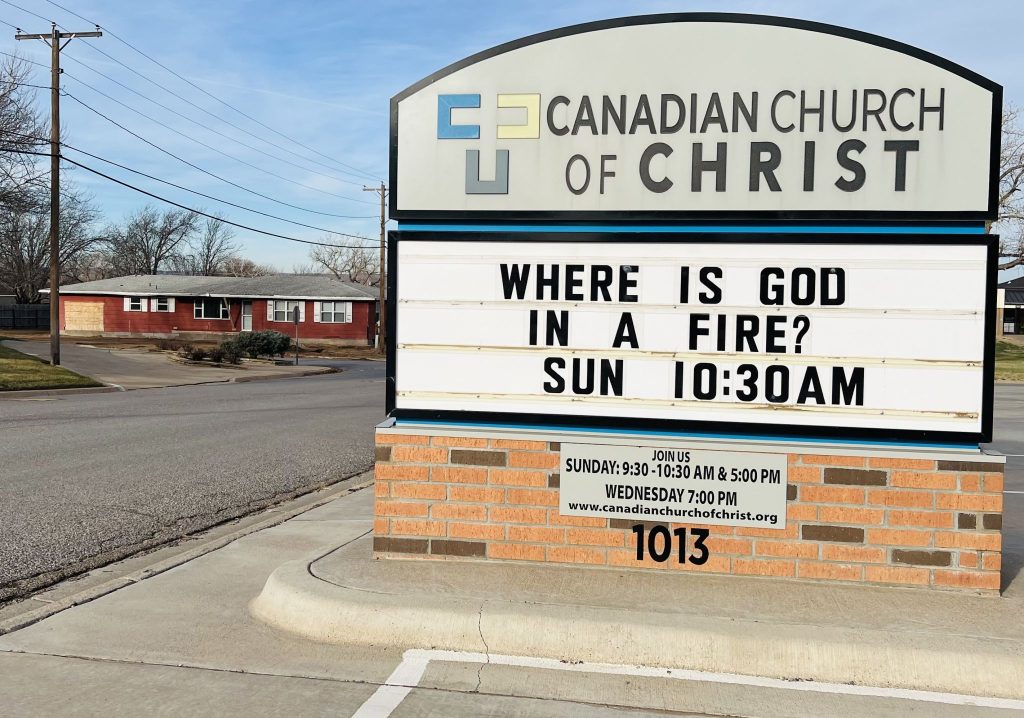 The sign at the Canadian Church of Christ after the fire.