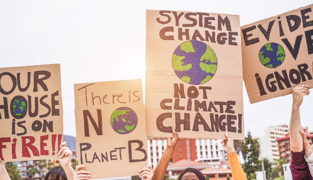 A group of demonstrators advocate for environmental policy change.