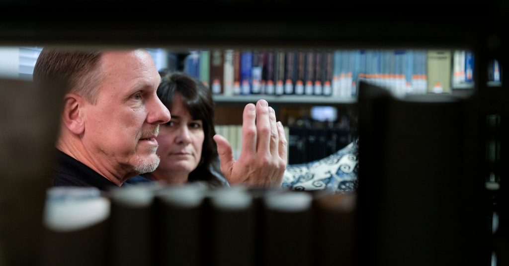 John Moore, an instructor at Bear Valley Bible Institute in Denver, makes a point as his wife, Carla, listens during an interview.