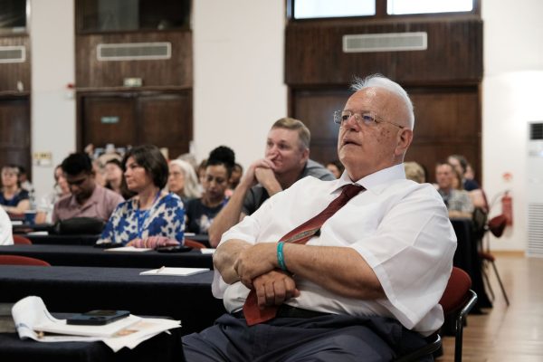 Dino Roussos, director of the Mediterranean Christian Conference and senior minister of the Glyfada Church of Christ, listens to a speaker.