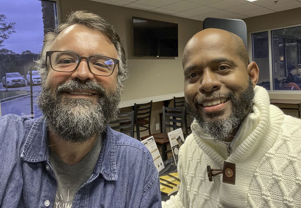 Orpheus Heyward, right, minister for the Renaissance Church of Christ and organizer of the Nehemiah Next Level Up Summit, was a gracious host. Erik Tryggestad, right, ran a sign-up booth for The Christian Chronicle during the event.