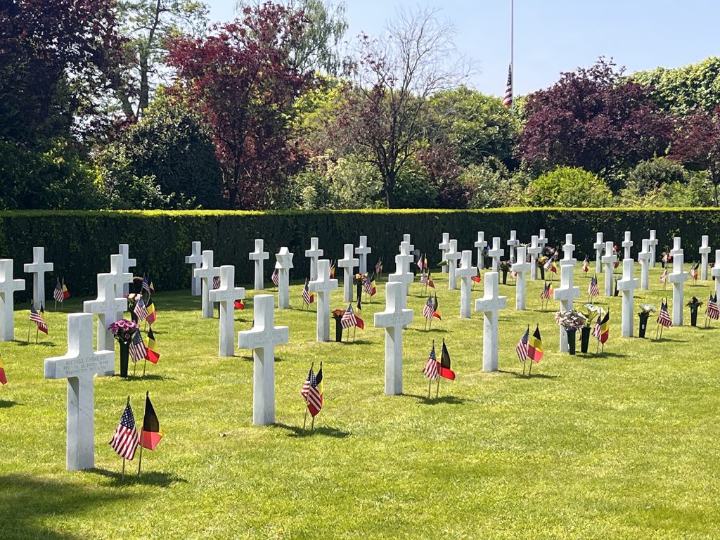 Crosses and stars of David stand in orderly rows at Flanders Field American Cemetery in Belgium.