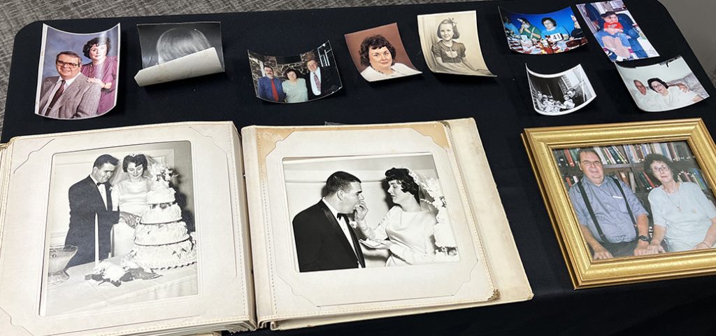 Photos of Glynna Hartman and her late husband, Ron, are displayed on a table at the Wilshire Church of Christ in Oklahoma City.