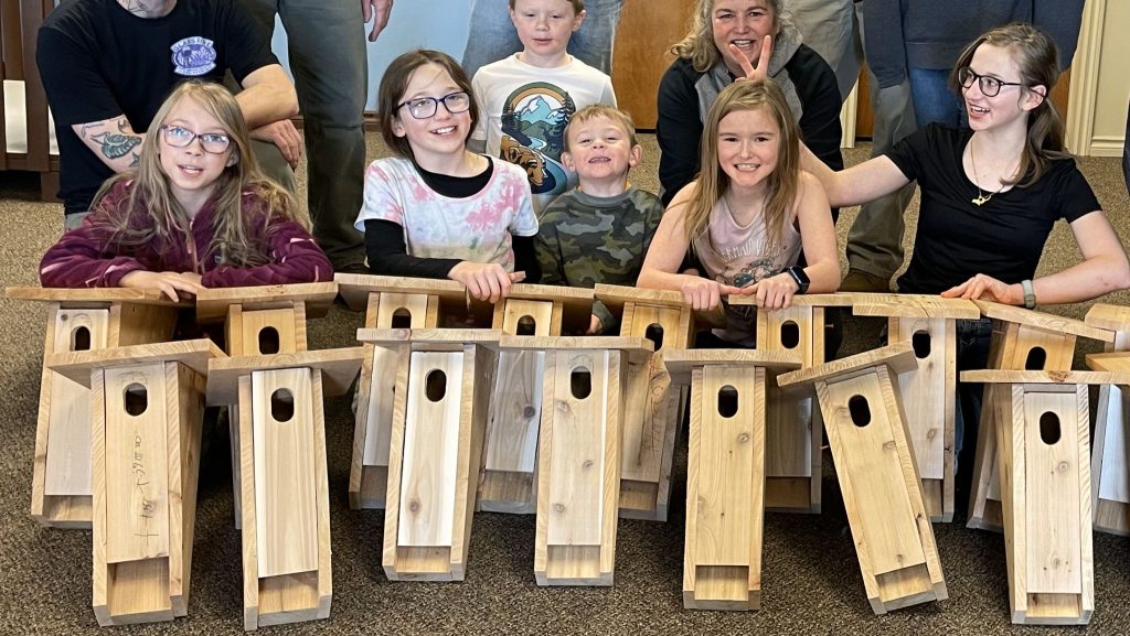 Children from the South Hills Church of Christ in Helena, Mont., show off their bluebird houses.