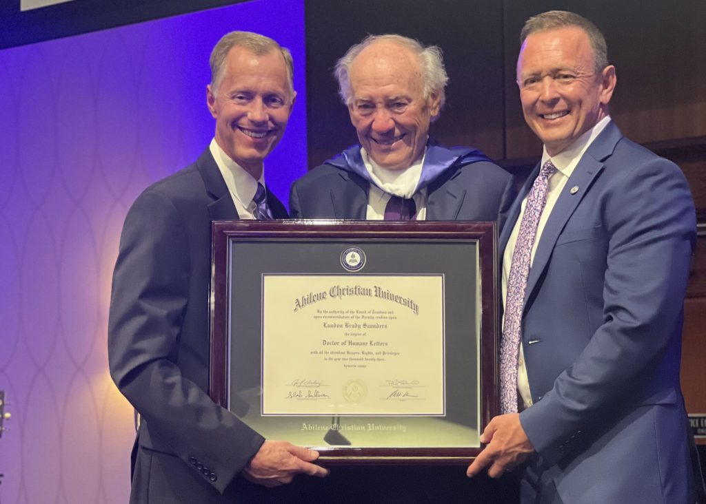 Robert Rhodes, ACU provost (left) and president Phil Schubert surprised Landon Saunders with an honorary doctorate during the annual Friends of the ACU Library event where the university announced creation of the Landon Saunders Center for Joy and Human Flourishing.