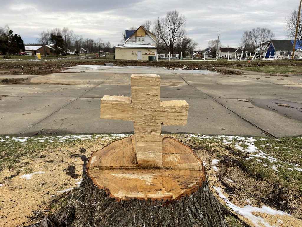 A cross is carved into a tree stump after deadly tornadoes swept across Kentucky and other states in December.