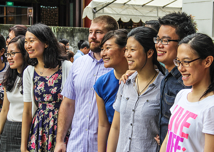 Young adult members of the Moulmein Church of Christ in Singapore pose for a photo during the church's farewell service. The congregation will demolish and rebuild its 55-year-old facility in this Southeast Asian city-state.