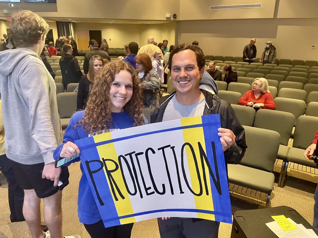 Members of the Grace Chapel Church of Christ in Cumming, Ga., hold signs at a prayer vigil for Ukraine.