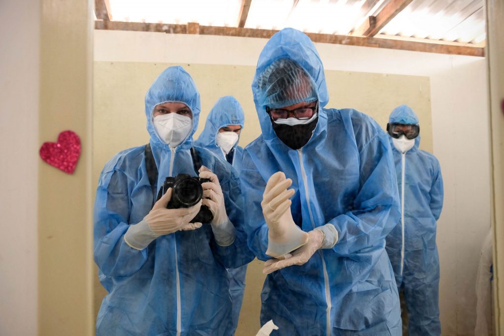 Audrey Jackson and Erik Tryggestad prepare to enter the COVID-19 ward.