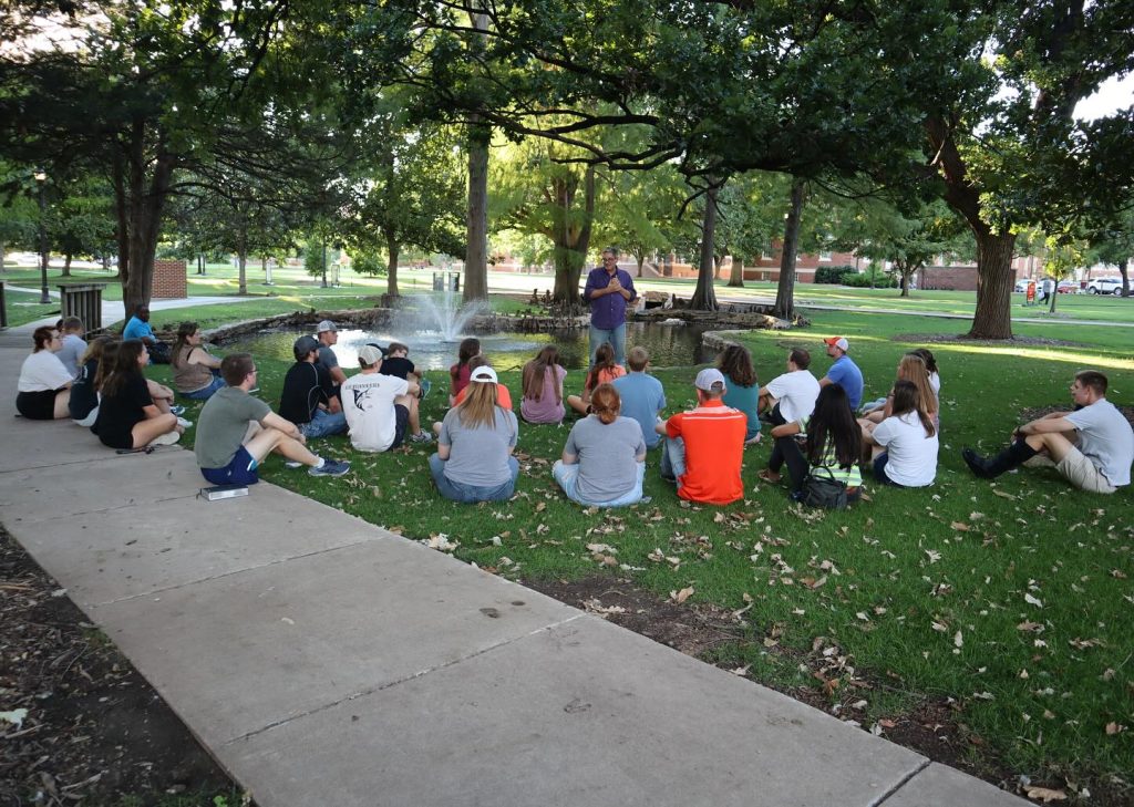 The late Monty Daffern leads a devotional on the Oklahoma State University campus.