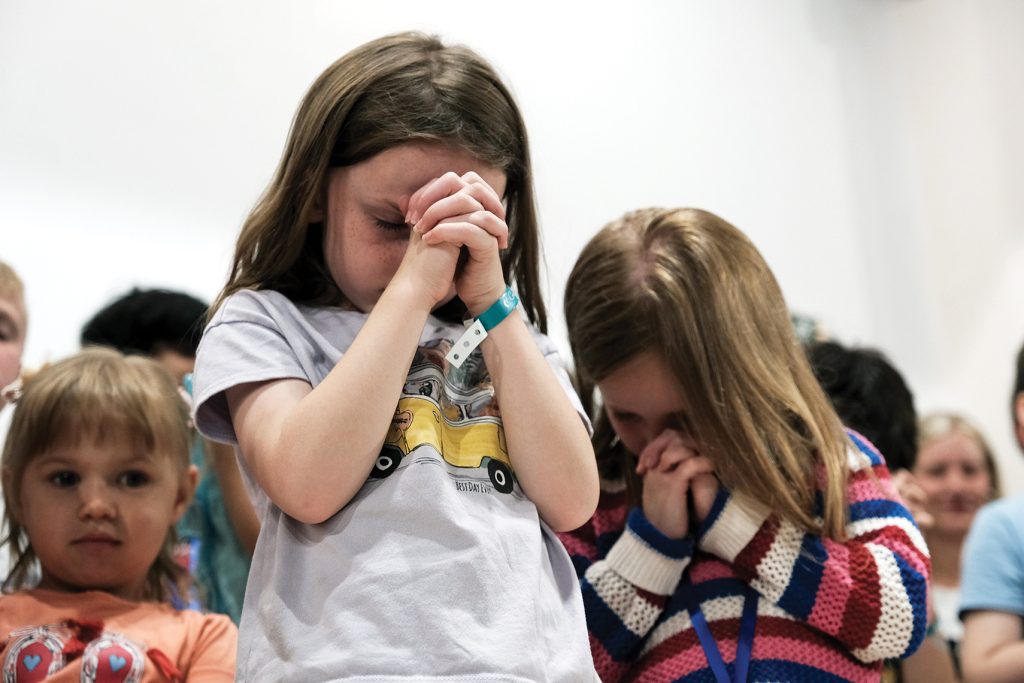 Children pray during the sixth Mediterranean Christian Conference in Marathon, Greece.