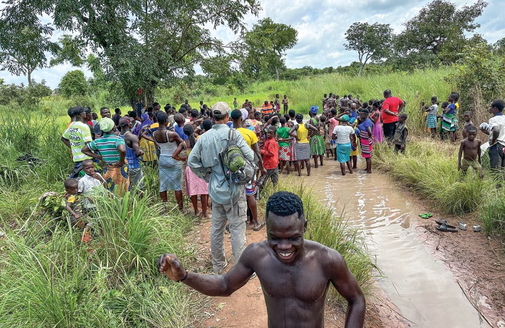 A smile crosses a teen’s face just after his baptism in the village of Ghanani, Ghana.