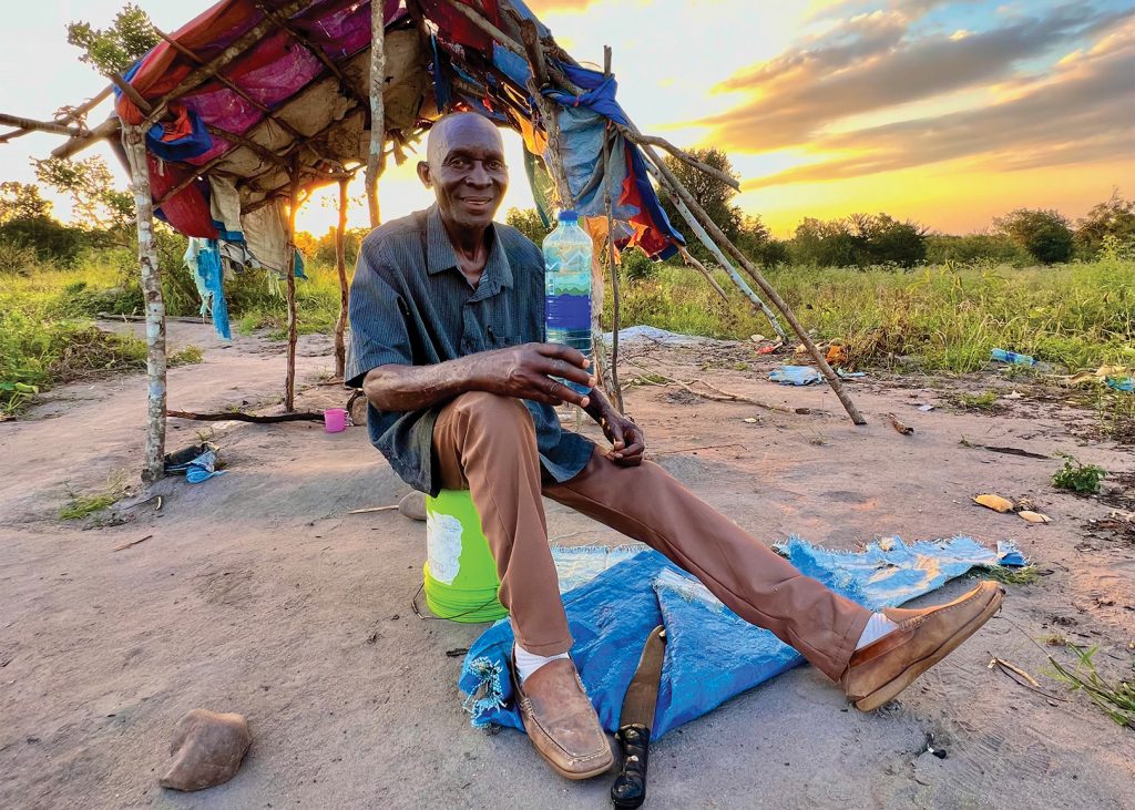 Joseph Kazidi takes a break during a long day of farming in east Tanzania.