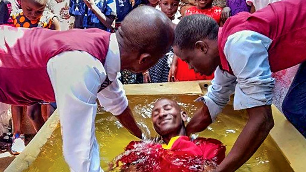 In Mityana, Uganda, Brian Ngobi is all smiles as he becomes a new creation in Christ.