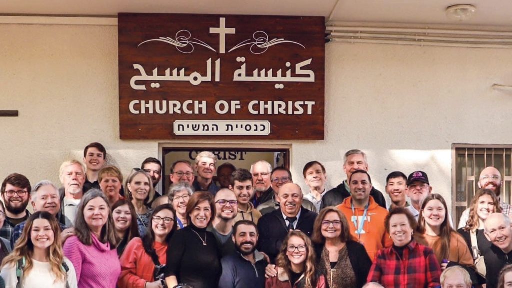 Visitors gather outside the church building in Nazareth.