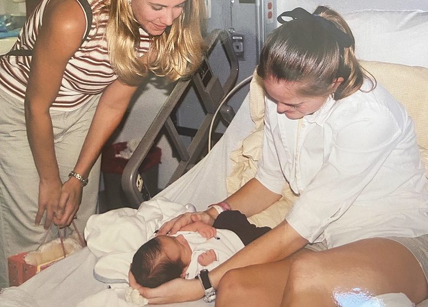 Jennifer Griffith holds her birth son on a hospital bed in September 2000.