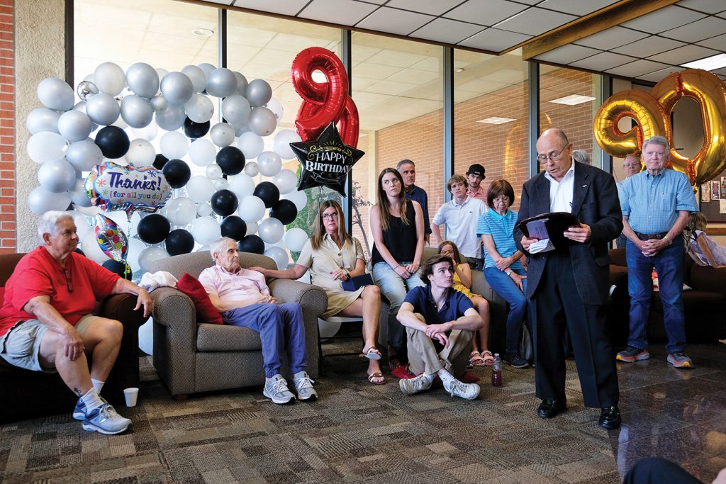 Bailey McBride is surrounded by his children, grandchildren and great-grandchildren during his 90th birthday celebration, held in the lobby of the Beam Library on the campus of Oklahoma Christian University, which owns The Christian Chronicle.