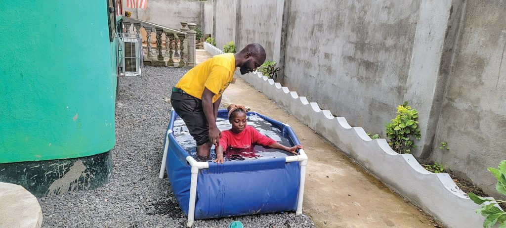 A new believer is baptized during the Back to the Bible campaign in Liberia.