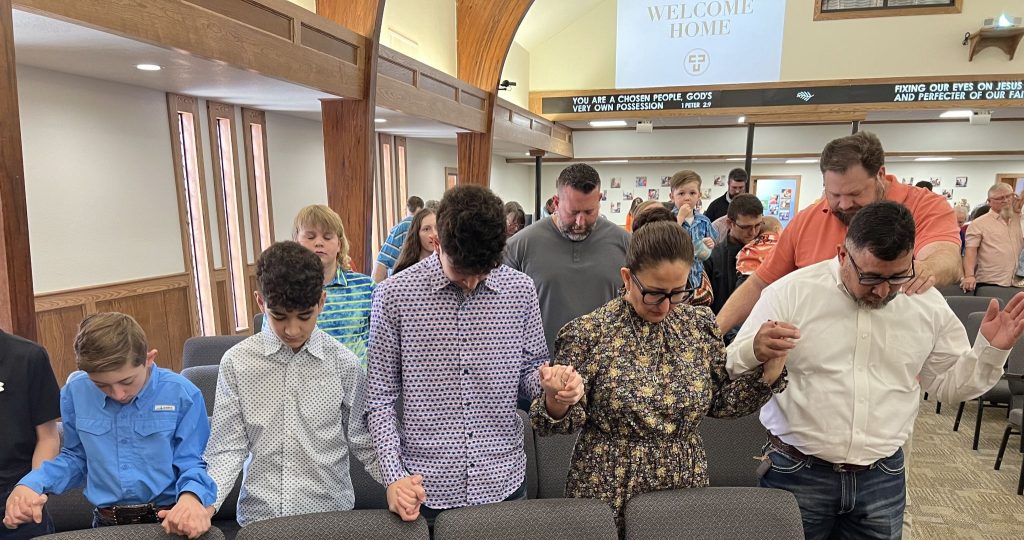 The Canadian Church of Christ prays Sunday after a wildfire hit the Texas Panhandle town.