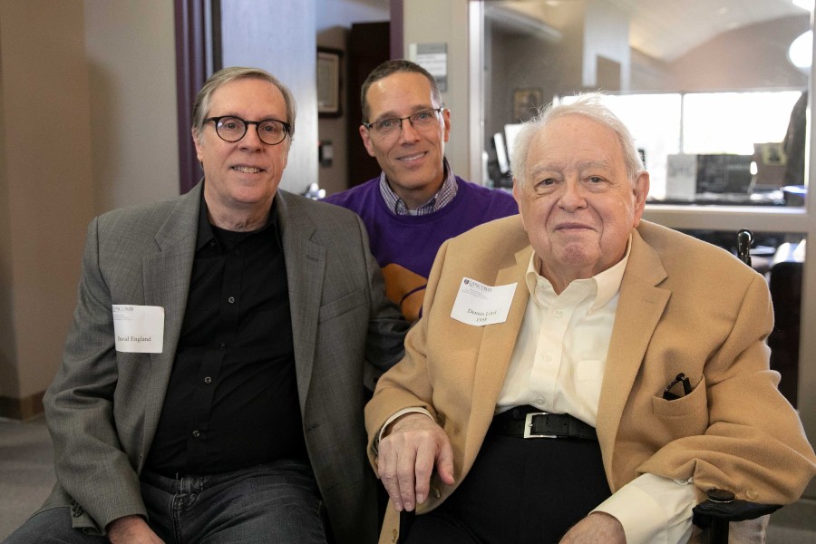 Dennis Loyd, right, visits with David England, former news bureau director for Lipscomb University, and Jimmy McCollum, communications professor, during a celebration of 100 years of student journalism at Lipscomb in 2023.