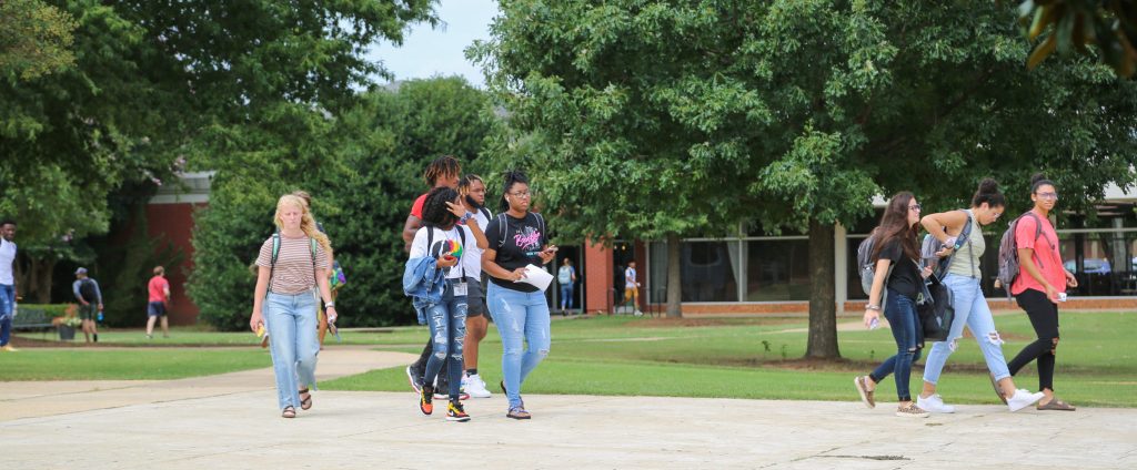 Students walk across Faulkner’s University's Quad.