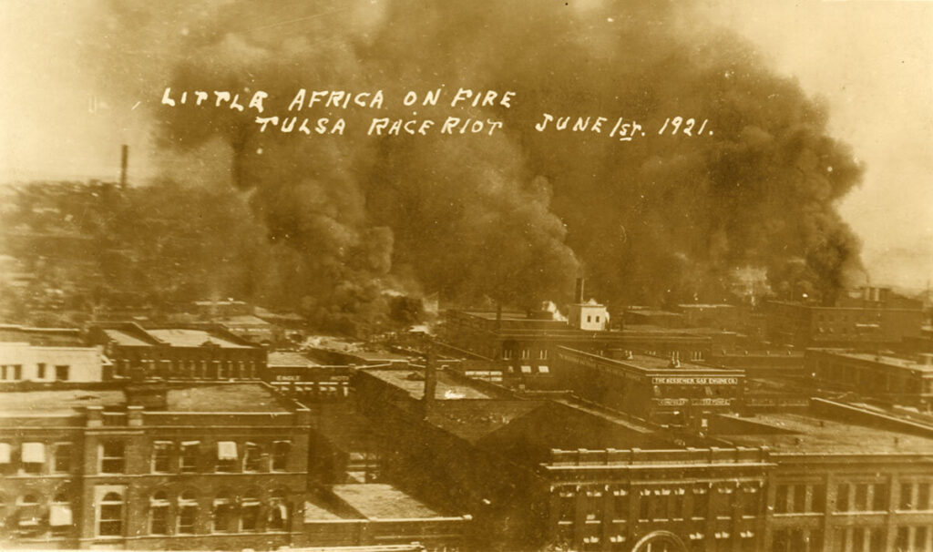 The Greenwood District burns during the Tulsa Race Massacre of 1921.