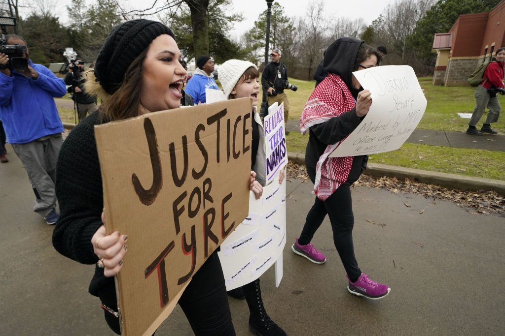 A group of demonstrators protest outside a police precinct Jan. 29 in response to the death of Tyre Nichols, who died after being beaten by Memphis police officers, in Memphis, Tenn.