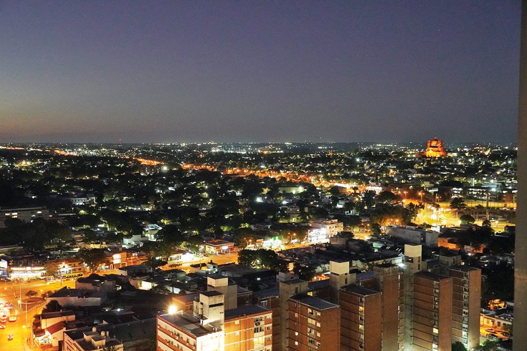 The National Shrine of the Sacred Heart of Jesus, right, stands among the buildings of the nighttime skyline in Montevideo, Uruguay.