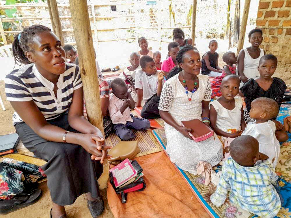 Members of a young Church of Christ that meets in a home in the village of Namagoma, Uganda, listen as visiting minister Michael Simbwa teaches from Acts 2:42-47 (“They broke bread in their homes and ate together with glad and sincere hearts”). Simbwa ministers for the Mityana Church of Christ, which meets about three hours northeast of the house church.